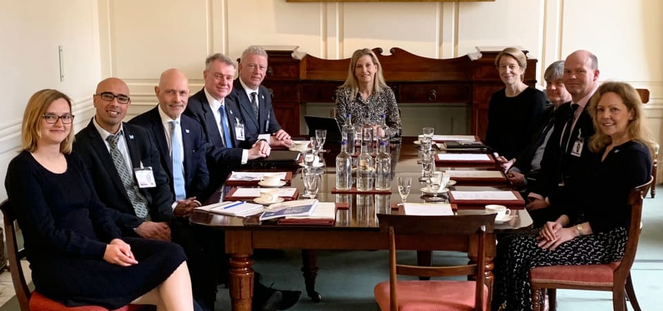 HRH The Duchess of Edinburgh sits around a table with senior members of DEBRA and the NHS