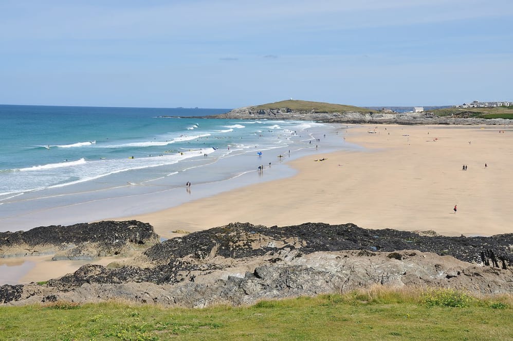 A photo of the beach, sea, and surrounding landscape at Fistral Beach in Newquay.