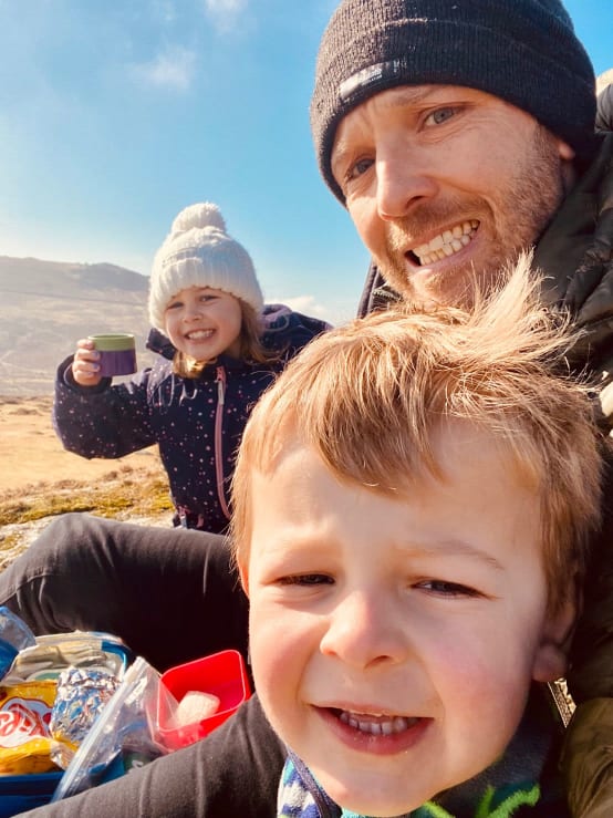 Selfie of Tim Jackson hiking with his daughter and son.