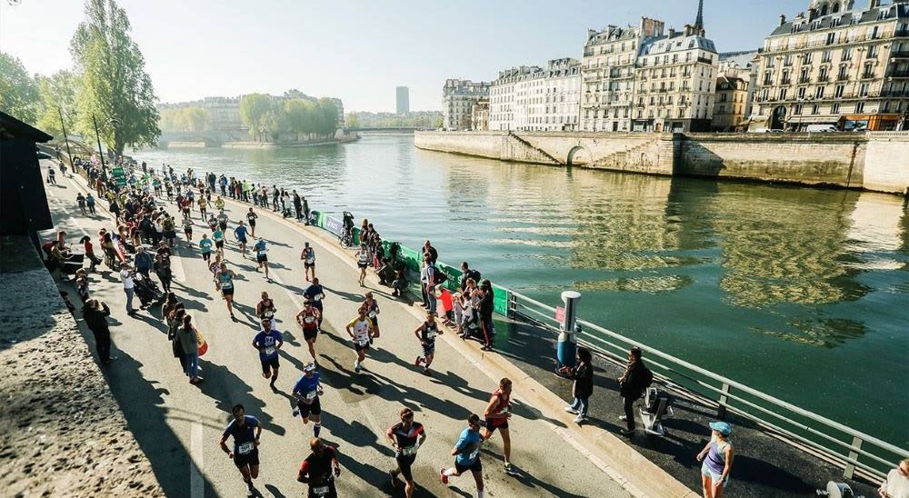 A group of marathon runners by river Seine in Paris.