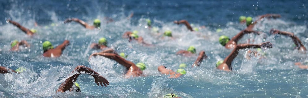 A group of swimmers in open waters