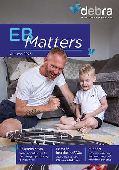 The cover of DEBRAs members newsletter, EB Matters, showing a man and his son smiling.