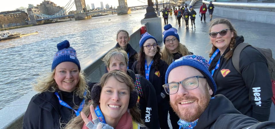 Group selfie in front of tower bridge in London.