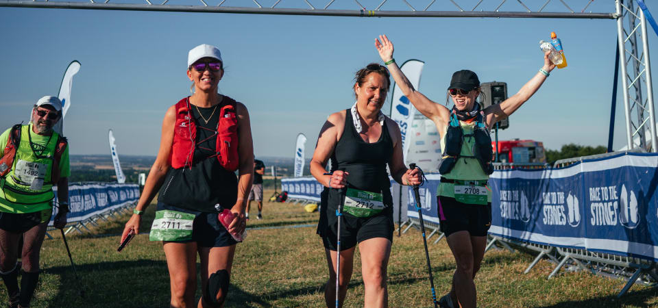 3 women cross the finish line of Race to the stones