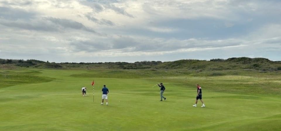 People playing golf at a DEBRA golf day