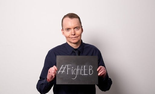 Mike Jaega, DEBRA Member, holding a #FightEB sign
